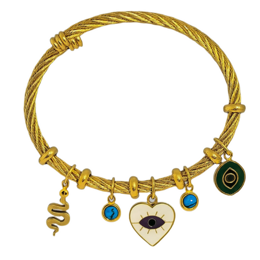 Gold bracelet with various charms on a white background