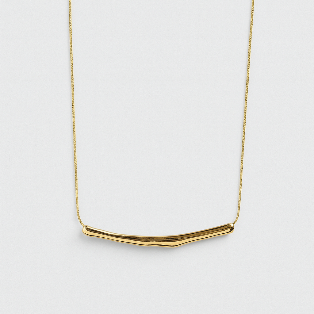 Gold necklace on a white background