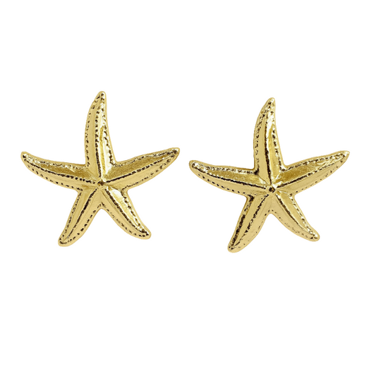 Gold starfish earrings on a white background
