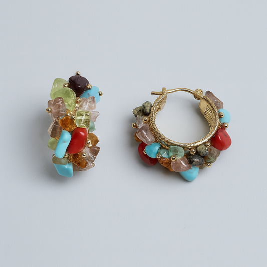 Colorful beaded hoop earrings on a light gray background

