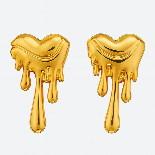 Gold heart-shaped earrings with a dripping design on a white background


