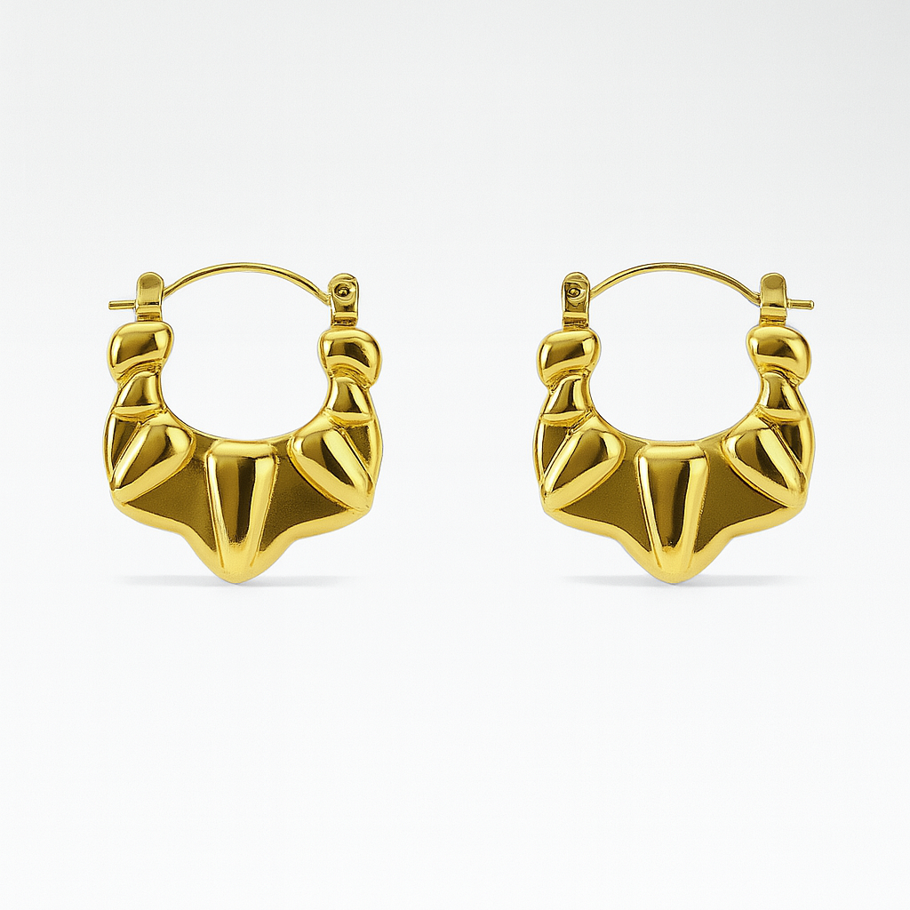 Gold hoop earrings on a white background

