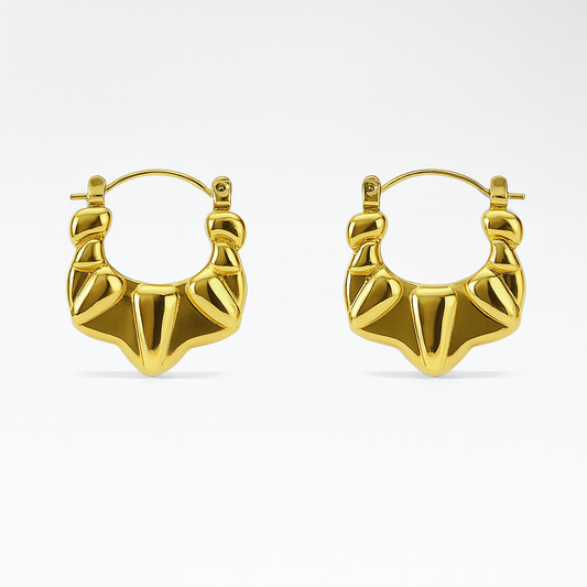 Gold hoop earrings on a white background

