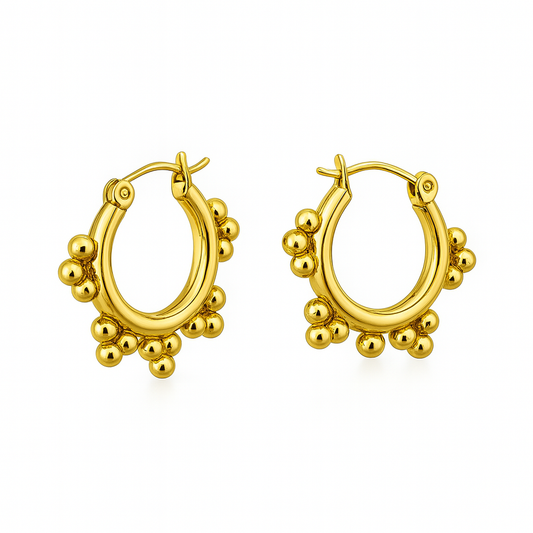 Gold hoop earrings with spherical embellishments on a white background

