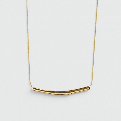 Gold necklace on a white background


