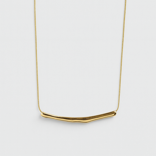 Gold necklace on a white background

