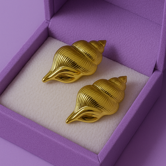 High-polish gold conch shell stud earrings placed on a solid white background – nature-inspired Indian statement jewelry for festive and modern wear